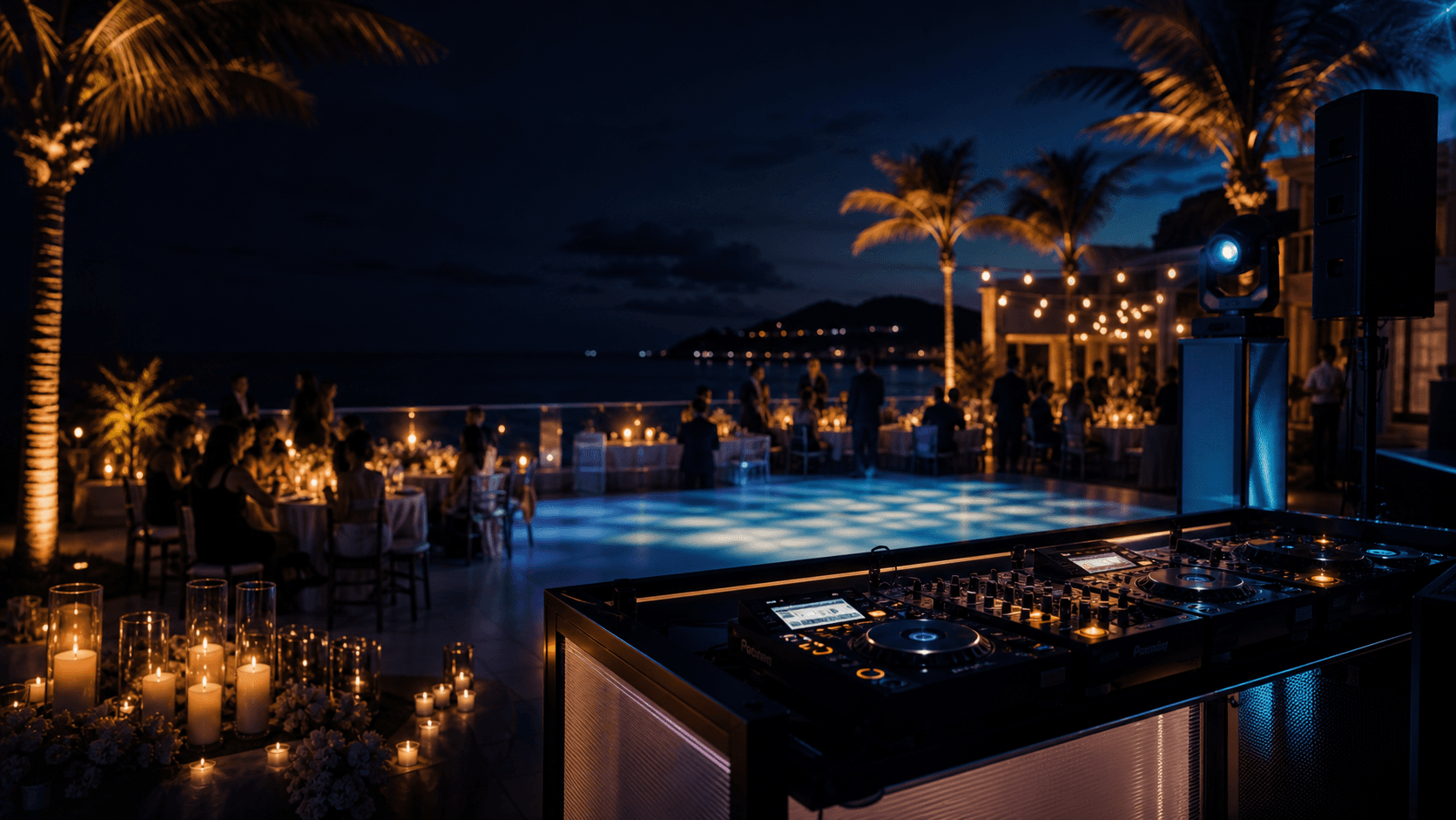 Wedding reception with guests dancing under refined lighting.